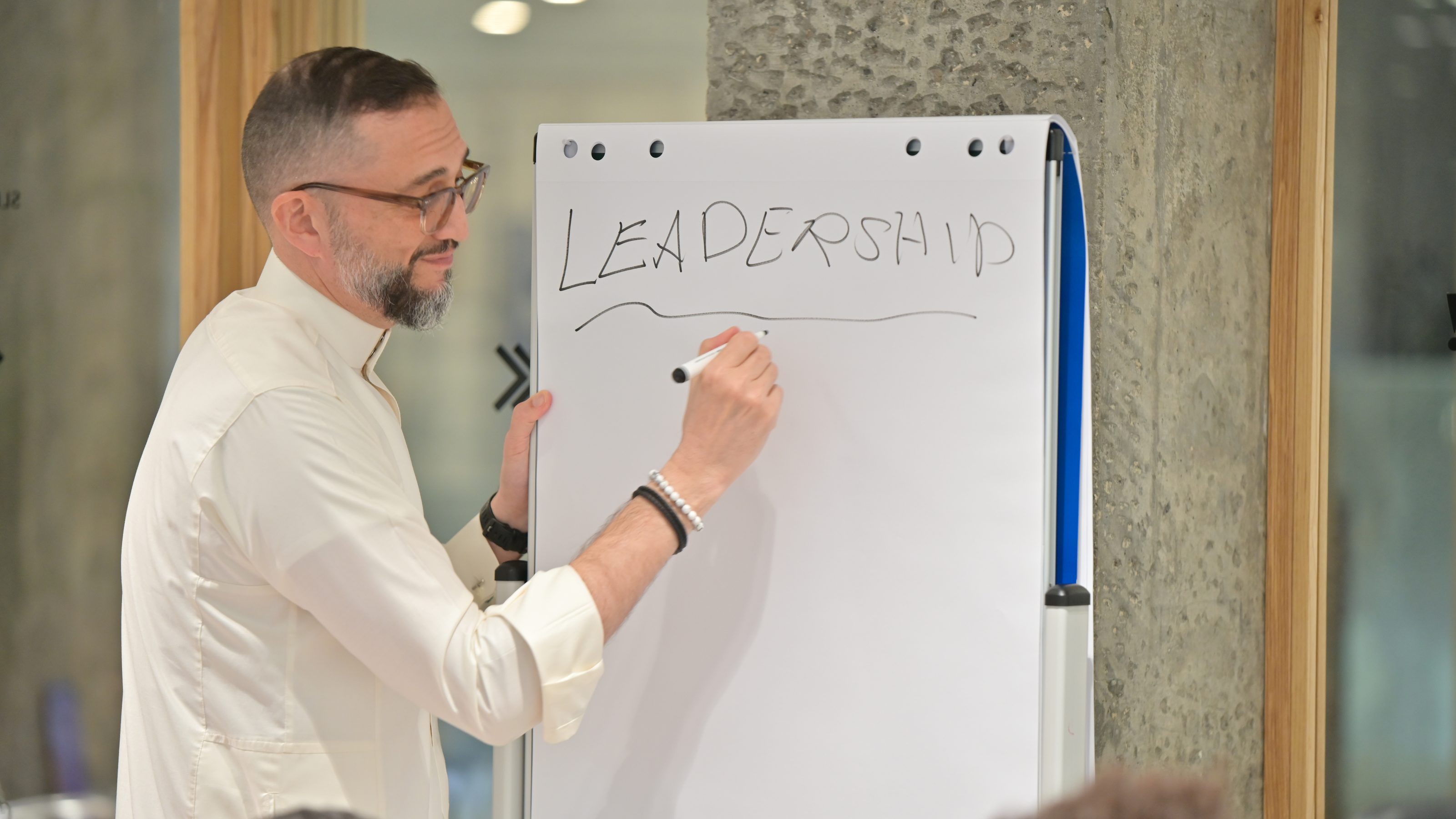 Suhail Algosaibi leading a session on leadership at a flip chart